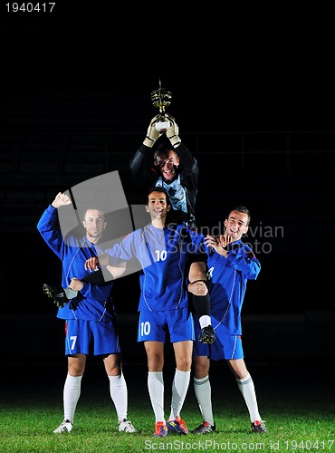 Image of football players celebrating the victory