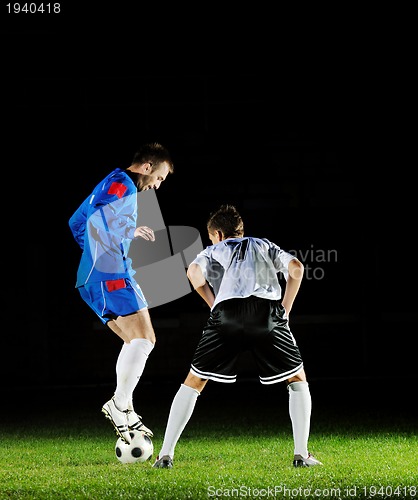 Image of football players in action for the ball