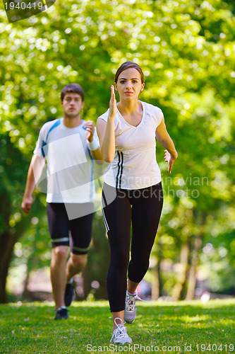 Image of Young couple jogging