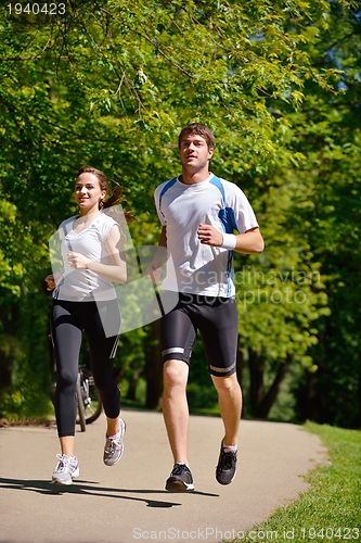 Image of Young couple jogging