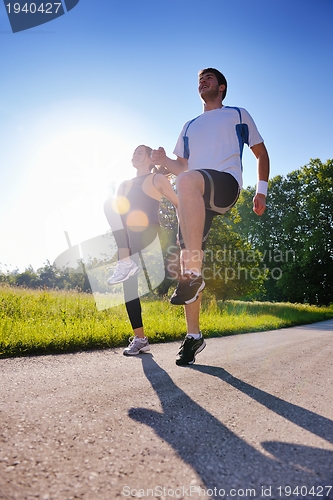 Image of Young couple jogging