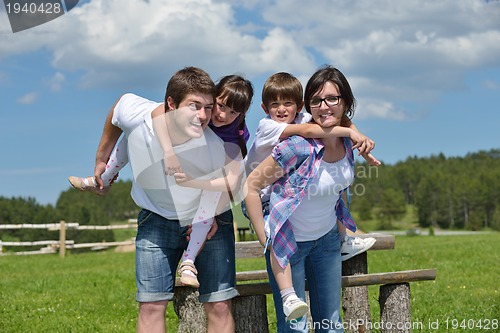 Image of happy young family have fun outdoors