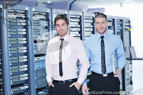 Image of it enineers in network server room