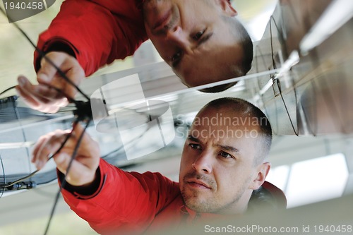 Image of Male solar panel engineer at work place