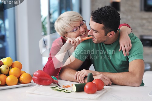 Image of young couple have fun in modern kitchen