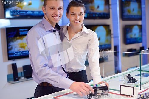 Image of people buy  in consumer electronics store