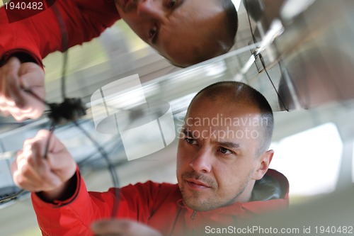 Image of Male solar panel engineer at work place