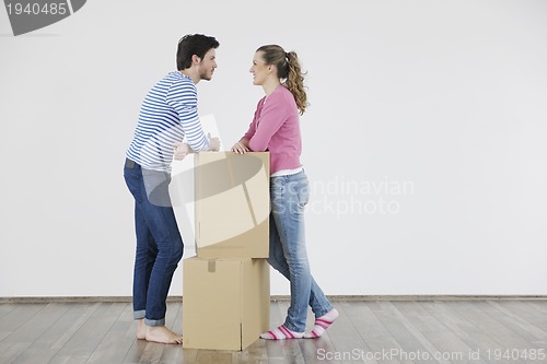 Image of Young couple moving in new home