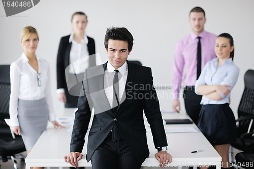 Image of young business man at meeting