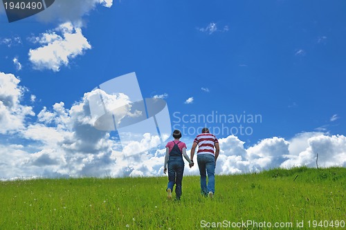 Image of romantic young couple in love together outdoor