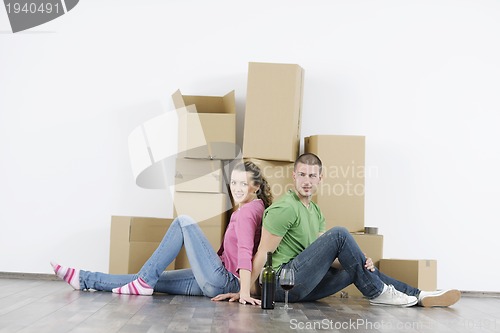 Image of Young couple moving in new home