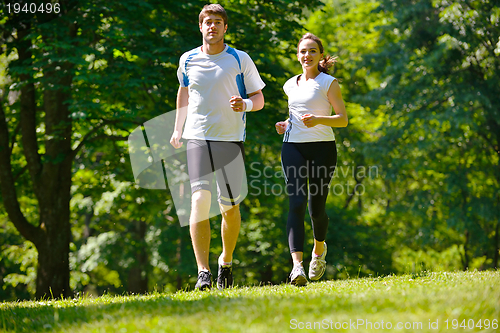 Image of Young couple jogging