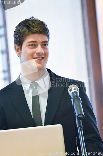 Image of Young  business man giving a presentation on conference