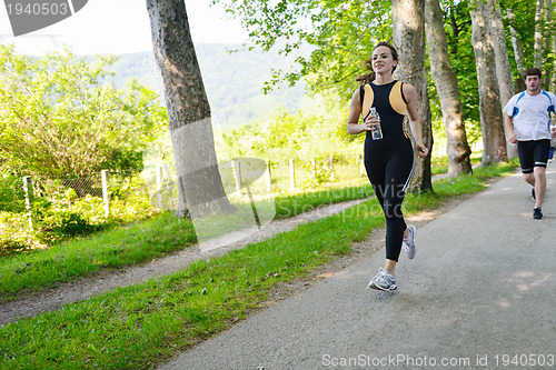 Image of Young couple jogging