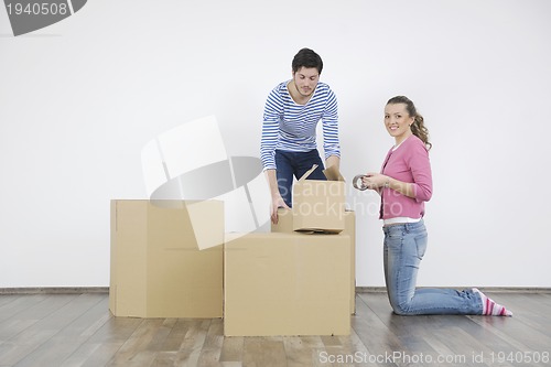 Image of Young couple moving in new home