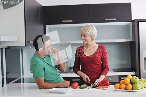 Image of young couple have fun in modern kitchen