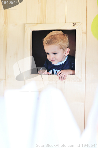 Image of happy child in a window