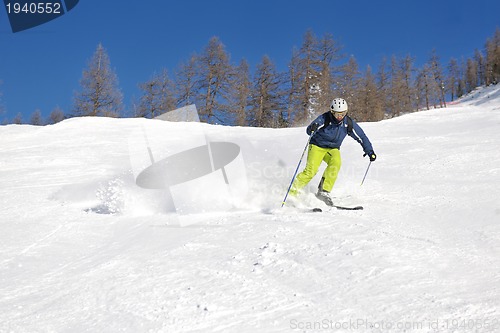 Image of skiing on fresh snow at winter season at beautiful sunny day