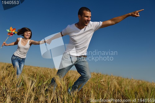 Image of happy couple in wheat field