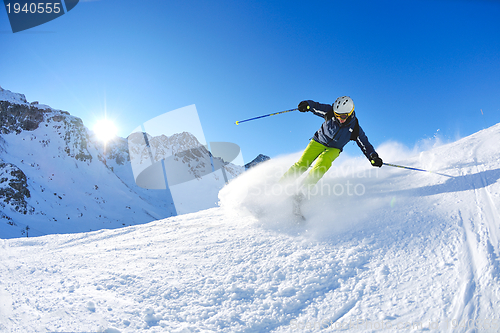 Image of skiing on fresh snow at winter season at beautiful sunny day
