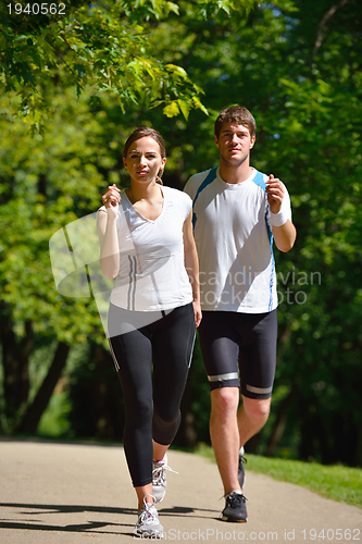 Image of Young couple jogging