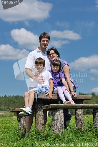 Image of happy young family have fun outdoors