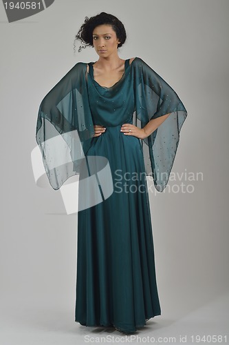 Image of elegant woman in fashionable dress posing in the studio