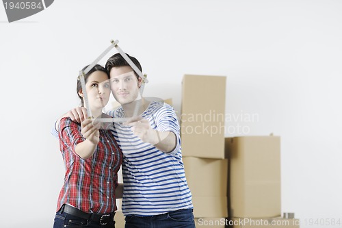 Image of Young couple moving in new home