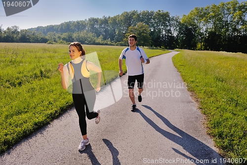 Image of Young couple jogging