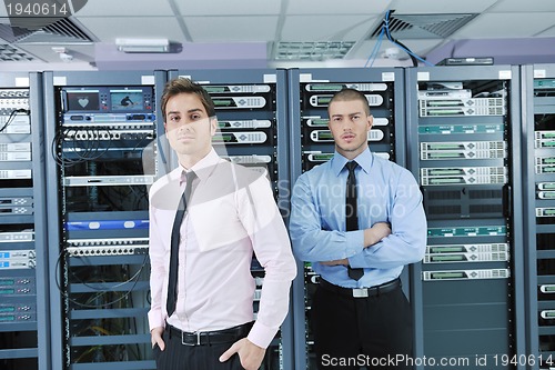 Image of it enineers in network server room