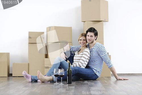 Image of Young couple moving in new home