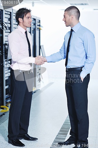 Image of it enineers in network server room