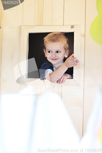 Image of happy child in a window