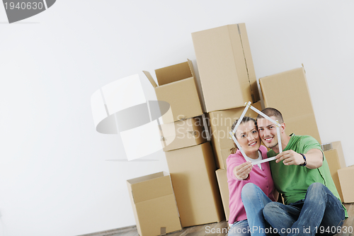 Image of Young couple moving in new house