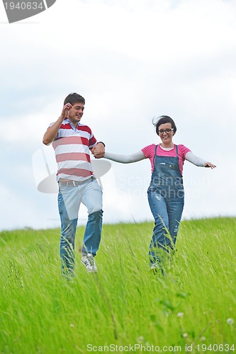 Image of romantic young couple in love together outdoor