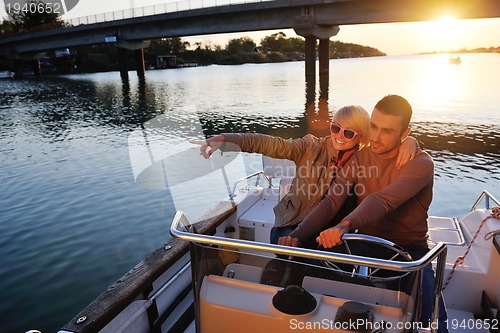 Image of couple in love  have romantic time on boat