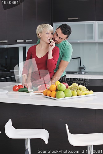 Image of young couple have fun in modern kitchen