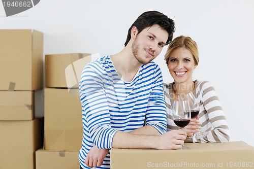 Image of Young couple moving in new house