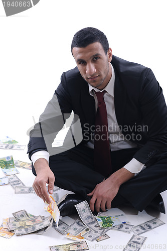 Image of Business man holding money