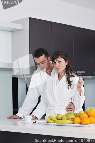 Image of young couple have fun in modern kitchen