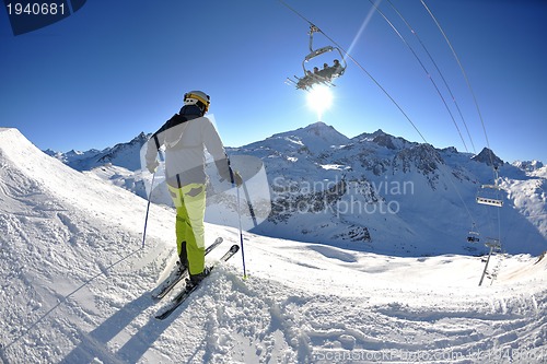 Image of skiing on fresh snow at winter season at beautiful sunny day