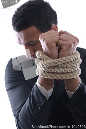 Image of business man with rope isolated on white background