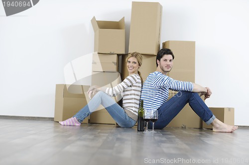 Image of Young couple moving in new home