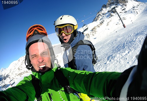 Image of winter portrait of friends at skiing