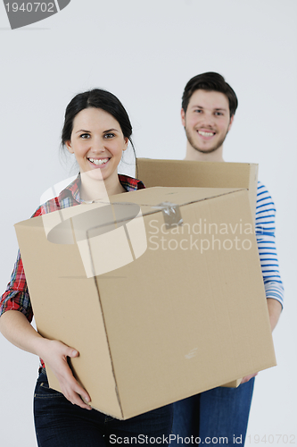 Image of Young couple moving in new home