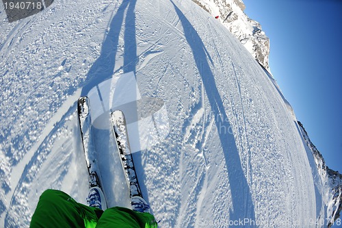 Image of skiing on fresh snow at winter season at beautiful sunny day