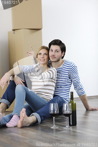 Image of Young couple moving in new home