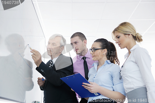 Image of Senior business man giving a presentation