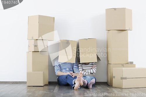 Image of Young couple moving in new home