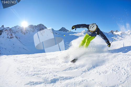 Image of skiing on fresh snow at winter season at beautiful sunny day